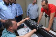 Setting the rail welded joints scanner onto a rail sample — engineer OKOndt Group carries out the training for the customer from  the USA, September 2019