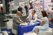 OKOndt Group's experts communicate with the ASNT Vice President D.Mandina at the company's booth at the 12 European conference of NDT, June 2018, Gothenburg, Sweden