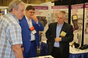 OKOndt Group's specialist with a visitor of the Exhibition ASNT-2017, Nashville, Tennessee, USA