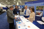 An attendee of the Railway Interchange-2019 getting acquainted with the product range represented at the booth of OKOndt Group, September 2019, Minneapolis, USA