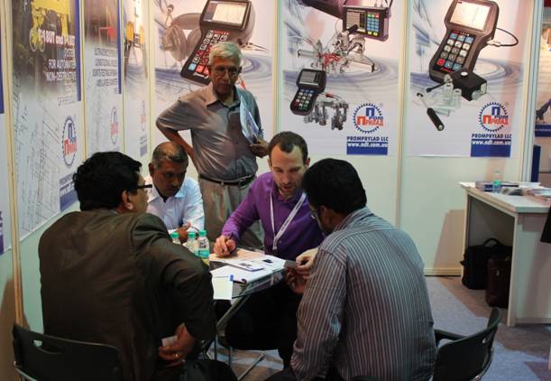 Discussing the business issues with the Indian colleagues at OKOndt Group's booth at the NDE-2014