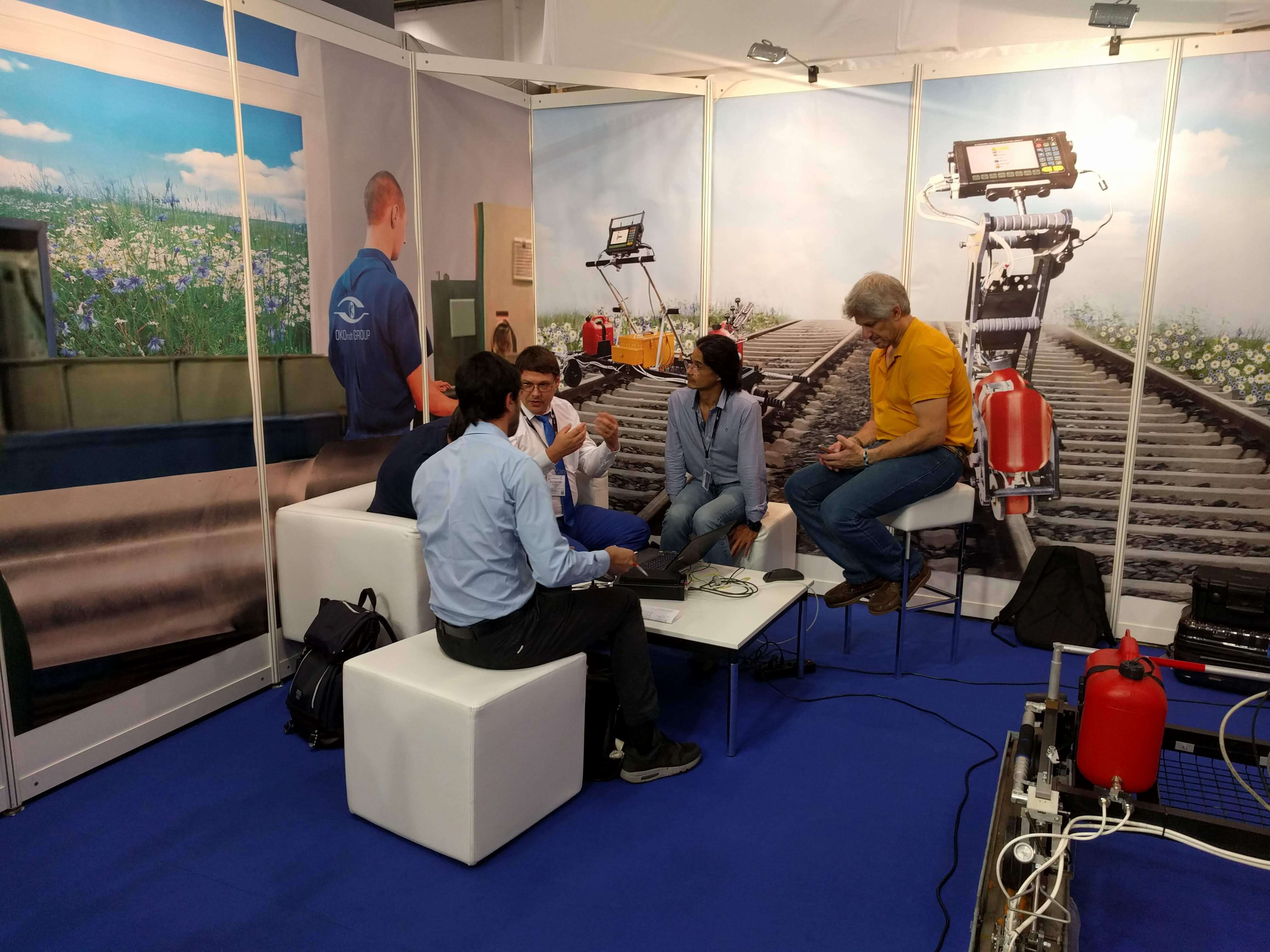 OKOndt Group specialists communicate with the colleagues at the company's booth at InnoTrans-2018, Berlin
