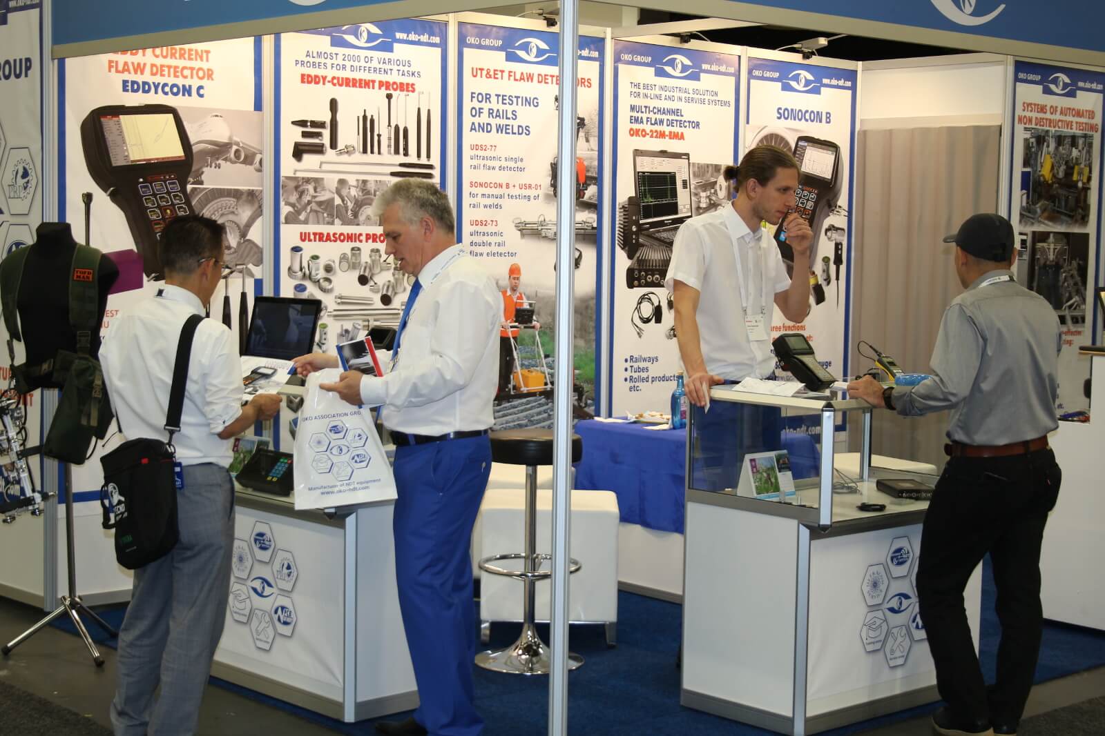 OKOndt Group's experts telling about the company's products to the attendees of the 12th European conference of NDT