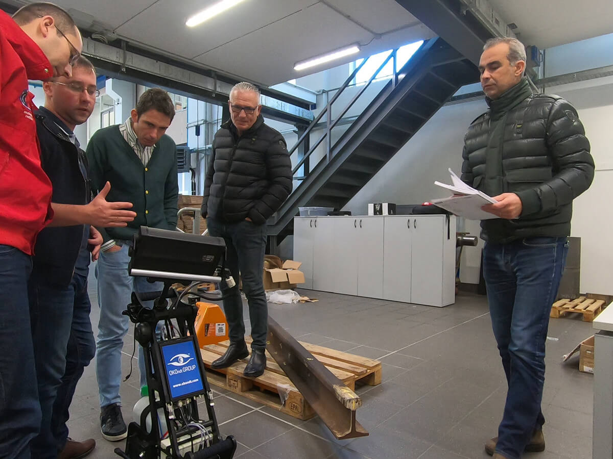 Preparation for demo of operation of the ultrasonic flaw detector UDS2-77 on a rail sample at the office of the Italian customer — on-site training carried out by OKOndt Group in November 2019