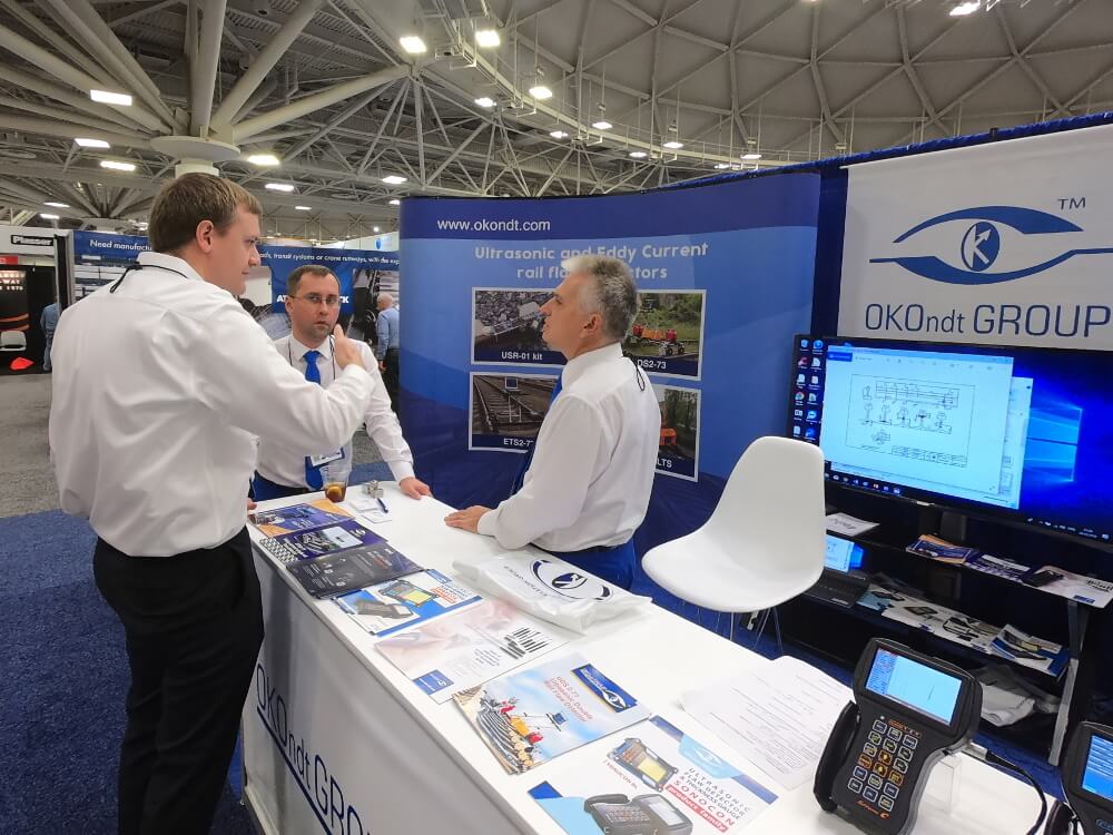 Delegates of OKOndt Group communicate with the Railway Interchange-2019 attendees who shown interest in the company's NDT equipment
