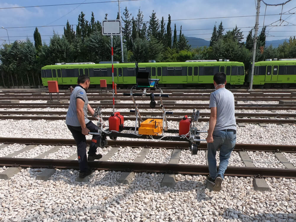 Placing the UT trolley UDS2-73 produced by OKOndt Group on rails before the practical training in Turkey, August 2020