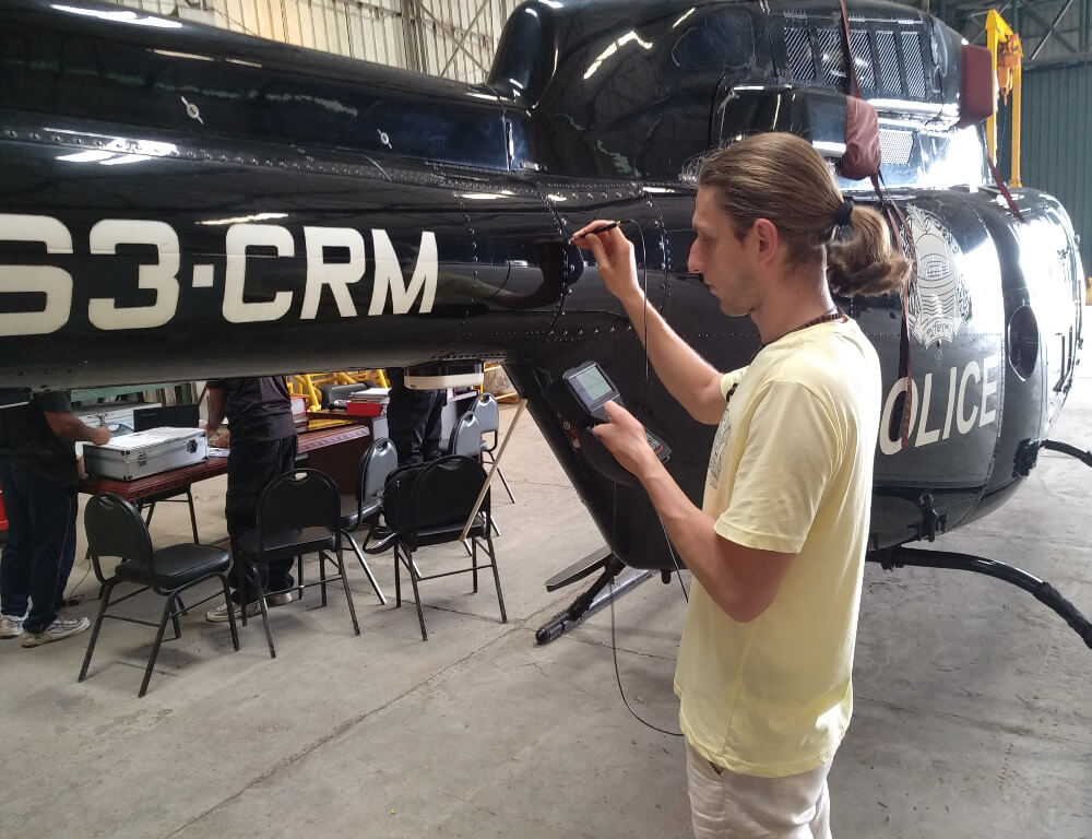 OKOndt Group's engineer perform a helicopter testing with the manual eddy current flaw detector Eddycon C — training at the customer's site, Bangladesh, May 2019