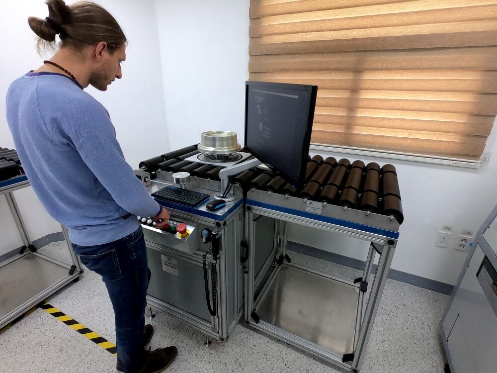 OKOndt Group's specialist perform the setting of the automated aircraft wheels testing system SmartScan, South Korea, customer's office, 2019